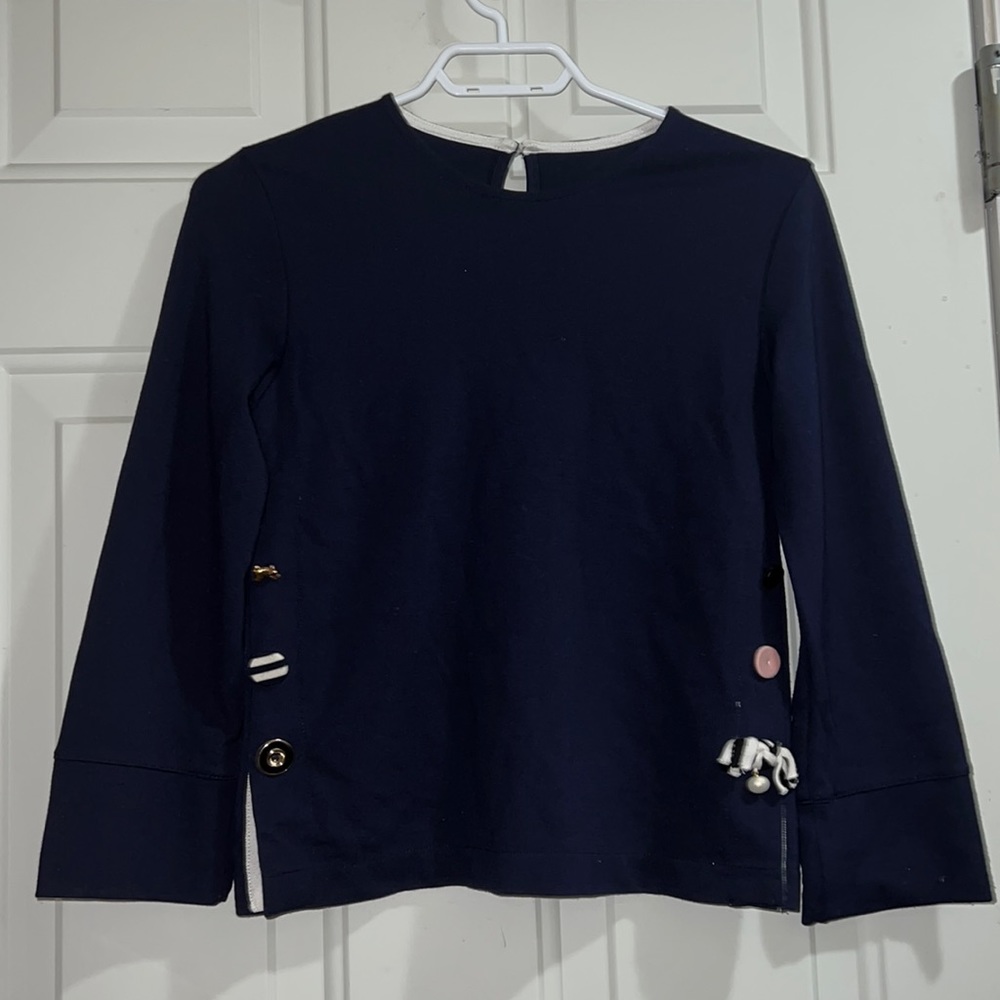Navy blue long-sleeved shirt with decorative buttons on sides